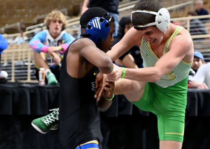 Adaias Ortiz from Osceola advances to the finals with a win over DJ Clarke from Buford during 113-pound semifinals match on Saturday at the Knockout Christmas Classic at Silver Spurs Arena in Kissimmee.